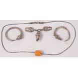 Nomadic silver jewellery including an amber bead.