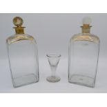 A pair of gilt decorated decanters, 19th century, height 22cm, another entitled 'Remember Me',