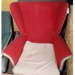 A 1950s Parker Knoll style wing armchair upholstered in red and grey fabric,