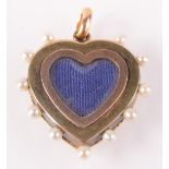 A gold heart pendant locket with a border of blue enamel and pearls. Maximum width 2.25cm.