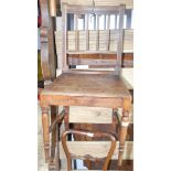 A Victorian moulded walnut kitchen chair on turned, tapering legs and an oak framed firescreen.