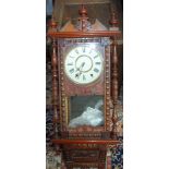 A carved walnut and mahogany wall clock, possibly American, late 19th/early 20th century,
