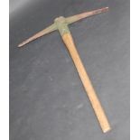 A WWII pick axe inscribed Hardy Pick Limited 1942, Sheffield, England, with wooden handle,