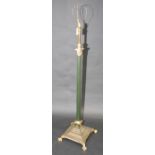 A Corinthian column glass and green lacquered standard lamp with cream lamp shade.
