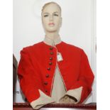 A red military jacket, with brass buttons inscribed 'South Devon Militaria',