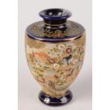 A Japanese Satsuma pottery baluster vase, decorated with a river and figures to the foreground,