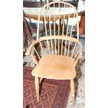 A Peter Marshall stickback Windsor armchair in 19th century style on turned tapering legs.