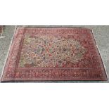 A Kashan rug, west Persia, the ivory field with a central vase of flowers, trees of life,