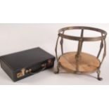 An arts and crafts brass stand height 30.5cm, and a fine English black leather writing case.