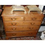 A George III light oak chest of small proportions fitted two short and three long graduated drawers