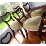 A set of six Victorian mahogany balloon back dining chairs with turned fluted legs.