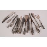 Two shoe horns, a pair of glove stretchers, and three manicure tools all with filled silver handles,