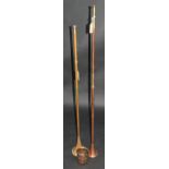 Two copper and brass coaching horns, length 121cm and 109cm, together with a J.