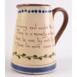 A Watcombe Torquay pottery jug, with verse 'For every evil under the sun,