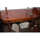 A mahogany Gillows style D-shape side table with fluted legs and brass castors.