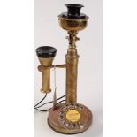 A brass candlestick telephone by G.E.C., height 34cm.