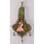 A post war Art Nouveau style enamelled plaque in a silver pendant mount with scrolling pierced back