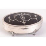 A good oval jewellery box the lid with pique tortoiseshell panel, Birmingham 1924, width 13.3cm.