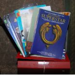 A box of theatre programmes.