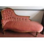 A good Victorian chaise lounge with shaped buttoned carved back,