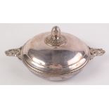 A Christophle oval serving dish with twin leaf moulded handles and artichoke cast finial.
