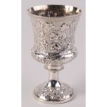A George IV campana form cup with repousse vine decoration to the bowl beneath a fluted rim,