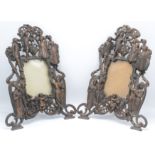 A pair of cast metal photograph frames,