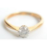 An 18ct gold solitaire diamond ring. Condition report: 2.