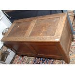 An 18th century oak panelled chest, width 104cm.