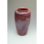 An important large Ruskin high-fired baluster vase with plum/purple and red/black mottled glaze,