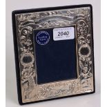 A modern silver mounted child's birth photograph frame.