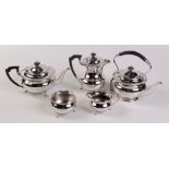 A five piece silver tea and coffee service of compressed spherical form with shaped borders by