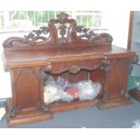 A remarkably ornate Victorian carved mahogany sideboard, width 213cm.