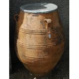 A massive terracotta olive jar,