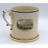 A large creamware mug, 19th century with three printed scenes of Bude, Cornwall, height 16.5cm.