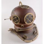 A copper and brass diving helmet with brass grills, height 44cm.