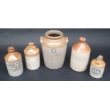 Four Redruth and Camborne stoneware flagons and a 'Jarvis' Redruth stoneware jar, height 35.5cm.