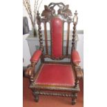 A Flemish carved oak large open armchair.