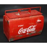 A metal red and white painted Coca Cola advertising cool box, length 43.5cm.