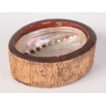 A Japanese oval wood box, with abalone shell to centre, tree bark to sides,