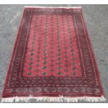 A Pakistan carpet, the pink field with seventeen rows of four medallions,