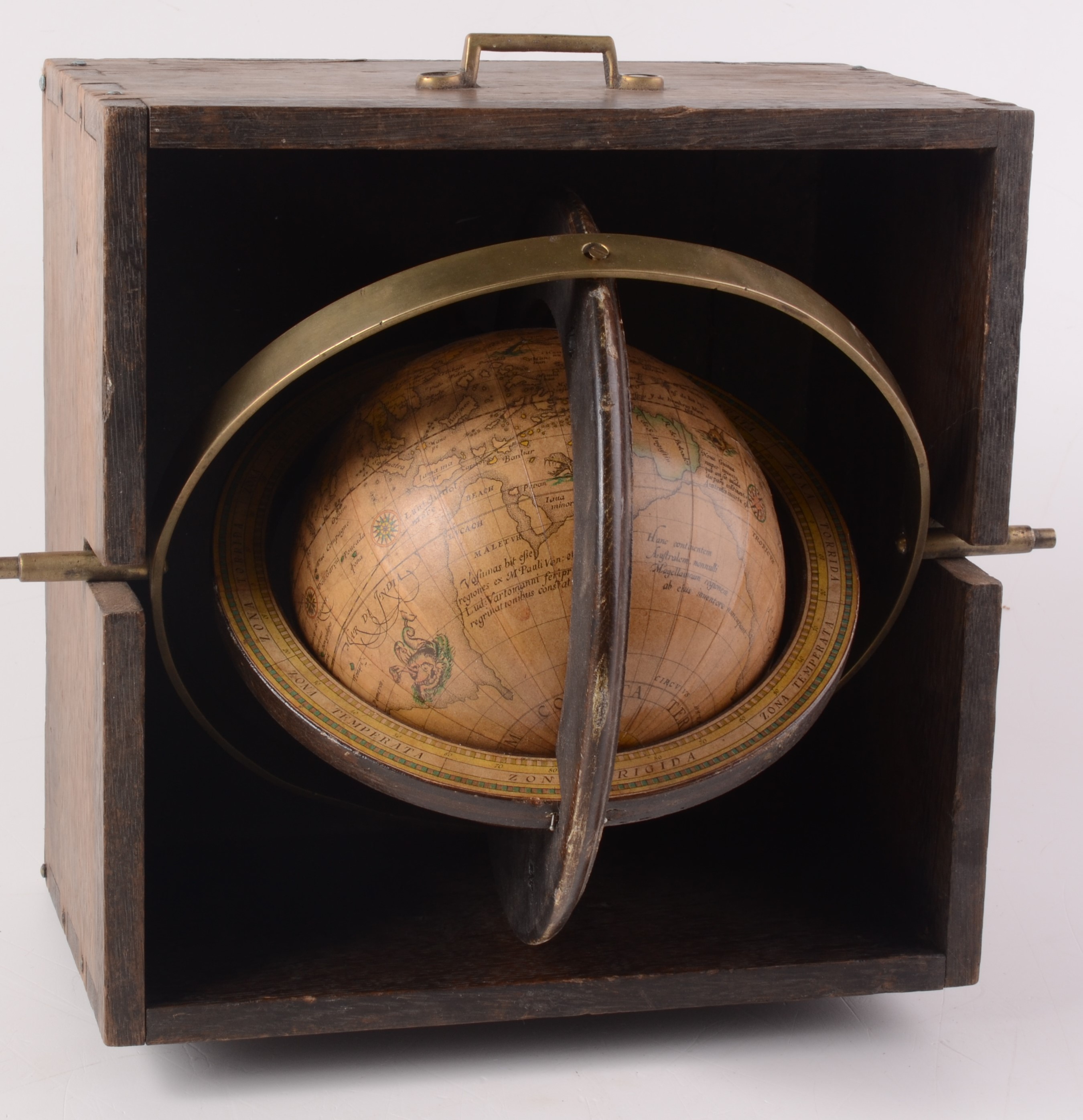 A 5 1/2" terrestrial globe dated 1963, inscribed 'Globum hunc Terraqueum', in an oak case,