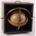 A 5 1/2" terrestrial globe dated 1963, inscribed 'Globum hunc Terraqueum', in an oak case,