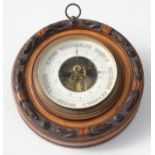 A German walnut cased, circular aneroid barometer, the 13cm dial inscribed 'F.