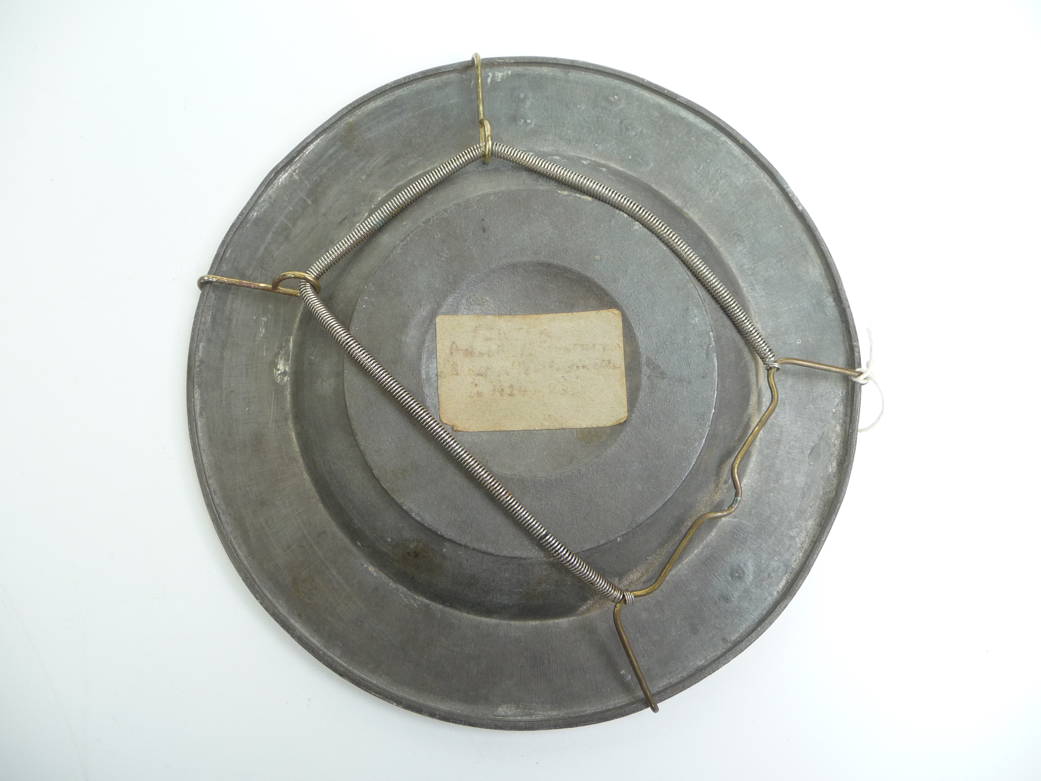 A pewter dish in 17th century style, to the centre Christ holds a flag and cross, - Image 5 of 5