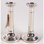 A pair of modern silver plain filled candlesticks in Georgian style, height 18cm.