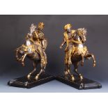 A pair of fine bronze, silvered and parcel gilt equestrian groups, one a Turk the other a Crusader,