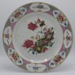 A Chinese famille rose porcelain charger, decorated with a vase of flowers,