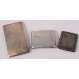 Three silver cigarette cases. 14oz.