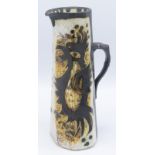 A Bill Fisher Celtic Pottery jug, the body decorated with parrots, height 25.5cm.